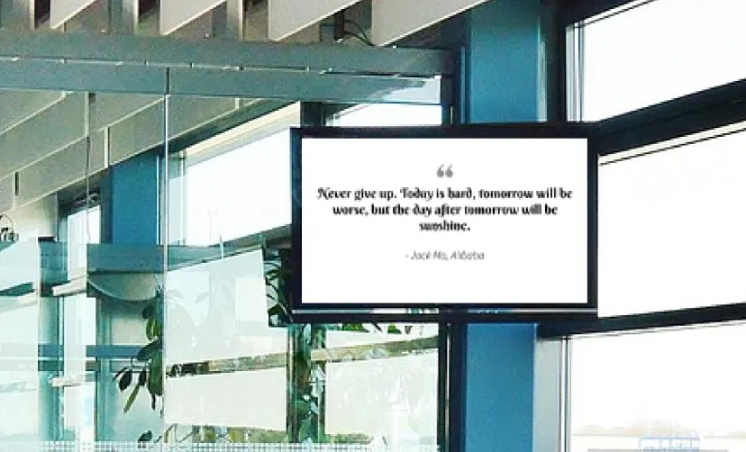 Digital signage screen placed outside interview room showing motivational quote using Pickcel digital signage software
