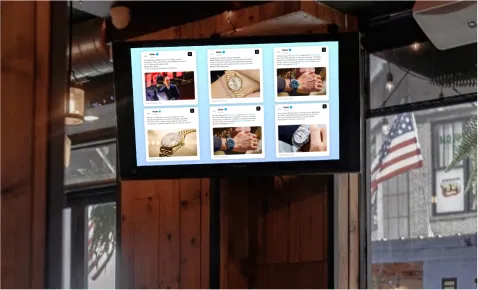 Digital signage screen displaying trending Twitter hashtag posts using Pickcel's Twitter Plus app
