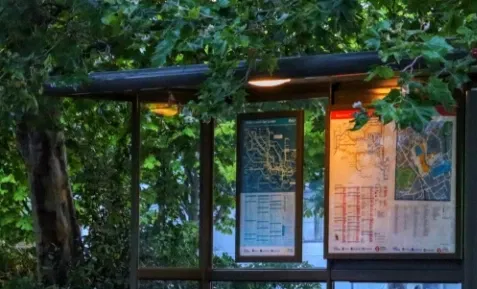 Digital signage showing weather alerts for commuters at public transportation locations