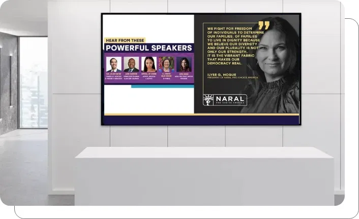 An office digital signage screen showing live conference updates