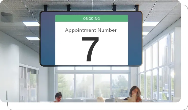 An office digital signage screen showing appointment information