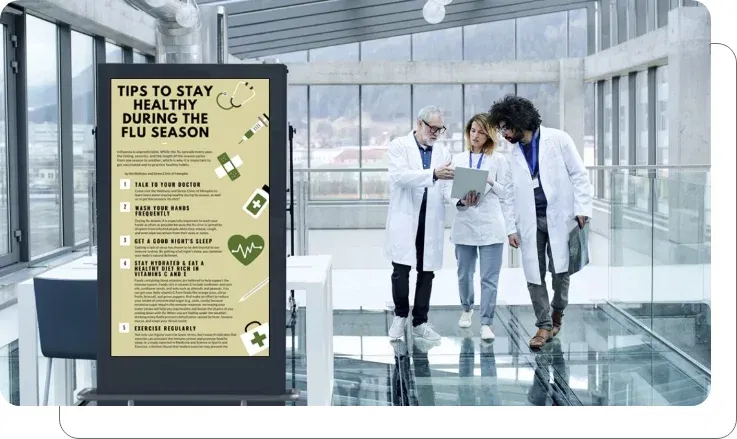 An office digital signage screen showing seasonal health tips
