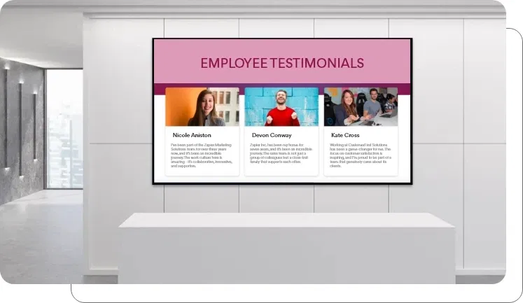 A digital signage screen showing client reviews in an office A digital signage screen showing client reviews in an office