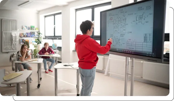 Students interacting with digital display in classroom Students interacting with digital display in classroom