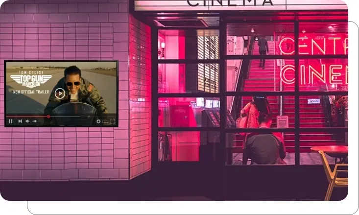 Digital signage screen showing interactive movie trailers and show times at cinema Digital signage screen showing interactive movie trailers and show times at cinema